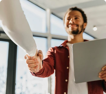 close up business people hand shake