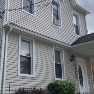 Vinyl dutchlap Siding in the color Mocha with White Trim