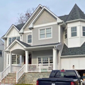 Vinyl Siding in Driftwood color with white Azek "board and batten" look