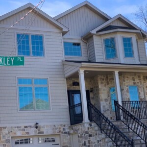 Vinyl Dutchlap Siding , Vinyl Shake and Board & Batten All in the color Victorian Whicker with White trim
