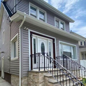 Vinyl Dutchlap Siding in the color Granite Gray with White Trim